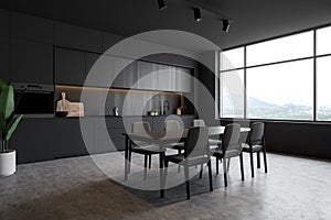 Dark gray loft kitchen corner with table