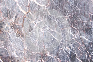 Dark gray marble texture with red and white vein patterns abstract nature background