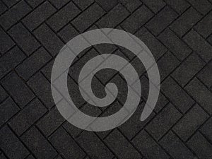 Dark gray paving block texture background
