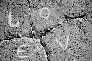 Dark gray stone wall  , inscription marriage broke up
