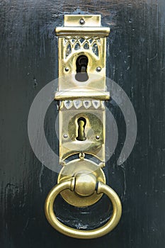 Dark green door with golden key hole