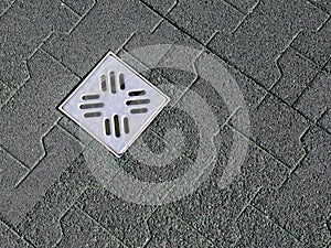 Dark green rubber tiles and canal grid