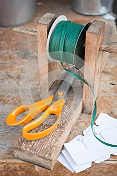 Dark Green Spool of Raffia on Wooden Stand with Scissors