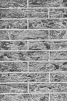 Dark grey abstract brick wall vertical texture background