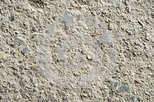 Dark grey asphalt pavement texture with small rocks