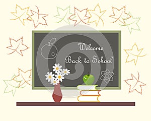 Dark grey blackboard with white lettering Welcome Back to School red vase with white flowers, green Apple on books