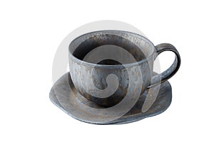 Dark grey ceramic hand made coffee or tea cup in rustic style isolated on white background