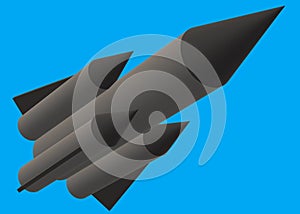 A dark grey long range rocket missile with black warhead blue backdrop photo