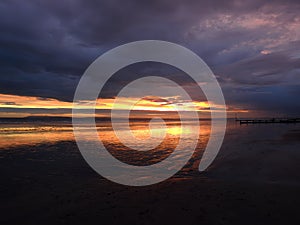 Dark grey and orange sunset at East Wittering