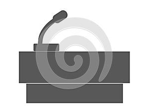 A dark grey simple outline shape of a speaker stand with a microphone for speeches white backdrop