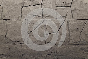 Dark grey stone tile texture brick wall surfaced.