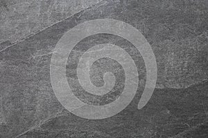 Dark grey stone wall texture . Gray rough backdrop. Stucco surface. Abstract pattern. Texture of natural granite