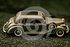 Dark grey vintage car . Retro car`s close up.Retro car on a dark background. Car close-up.