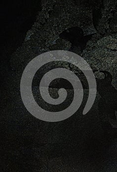 Dark grunge background texture with subtle light effects