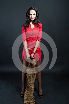 Dark haired tall girl in red dress smiling