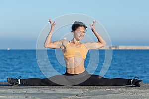 Dark-haired woman practicing gymnastic twine