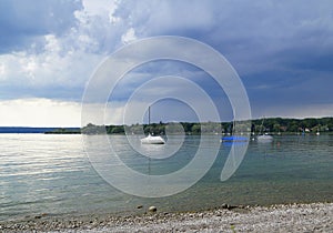 Dark heavy clouds over lake Ammersee in Herrsching (Bavaria in Germany) photo