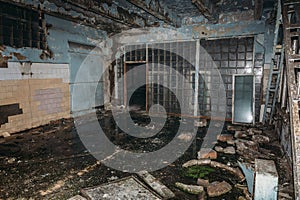 Dark industrial interior of ruined abandoned factory workshop