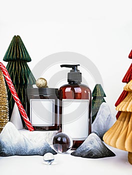 dark jar with lid and dispenser on the background of Christmas decorations, side view