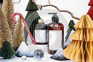 dark jar with lid and dispenser on the background of Christmas decorations, side view