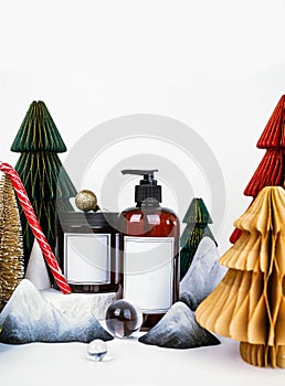 dark jar with lid and dispenser on the background of Christmas decorations, side view