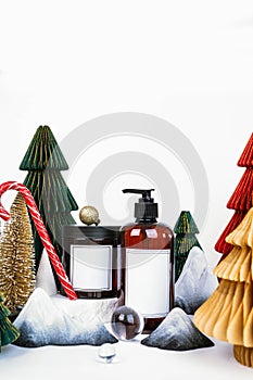 dark jar with lid and dispenser on the background of Christmas decorations, side view