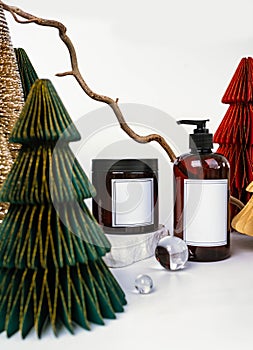 dark jar with lid and dispenser on the background of Christmas decorations, side view