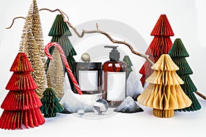 dark jar with lid and dispenser on the background of Christmas decorations, side view