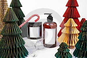 dark jar with lid and dispenser on the background of Christmas decorations, side view