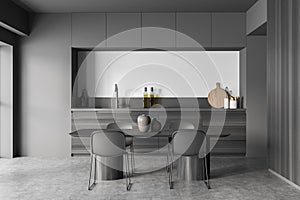 Dark kitchen room interior with dining table, four chairs