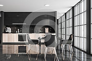 Dark kitchen room interior with table and four chairs