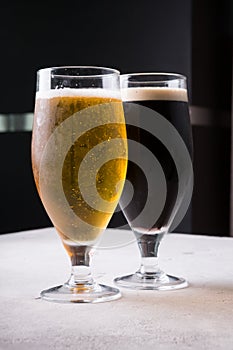 Dark and light beer glasses on a table