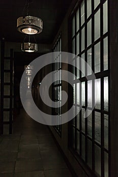 Dark long corridor hallway with window