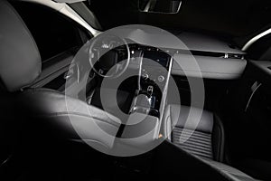 Dark luxury car Interior. Front seats of premium suv Leather panels. the view from the ceiling