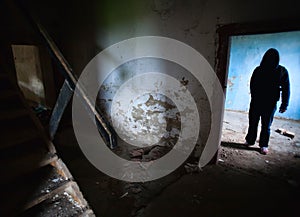 Dark man in old house