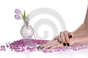 Dark manicure and lilac spa still life