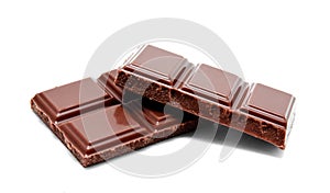 Dark milk chocolate bars stack on a white