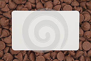 Dark milk chocolate chips with white card background