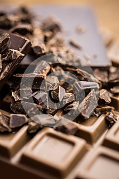 Dark and milk chocolate on a wooden table