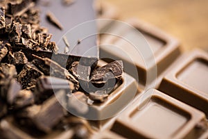 Dark and milk chocolate on a wooden table