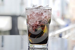Dark Mojito cocktail on the terrace