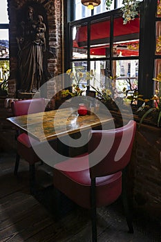 A dark and moody cozy restaurant table photo