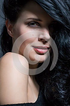 Dark moody portrait of a brunette beauty