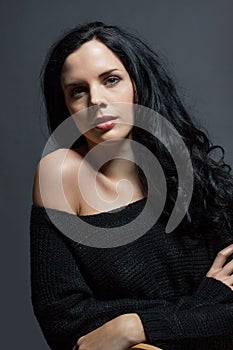 Dark moody portrait of a brunette beauty