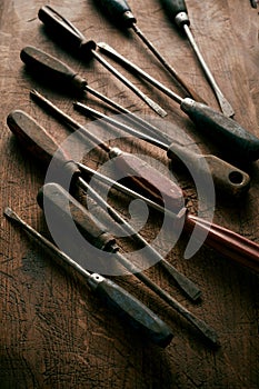 Dark moody still life of vintage screwdrivers