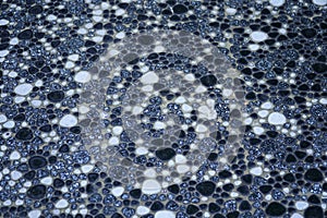 Dark mosaic pebble stone flooring photo