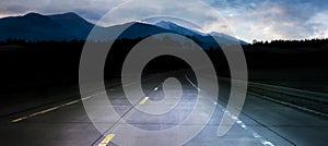 Dark night road through forest and mountains