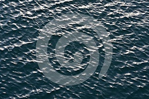 Dark ocean water surface with small waves