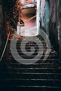 A dark old stone outdoor staircase