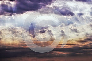 Dark ominous clouds. Dramatic sky with sunbeams